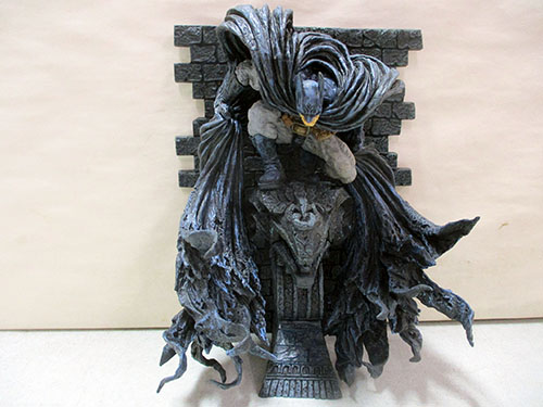 image of Batman Statue with Gothic Wall Backdrop
