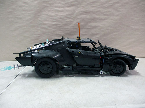 image of Custom-Built Black Model Car With Detailed Attachments