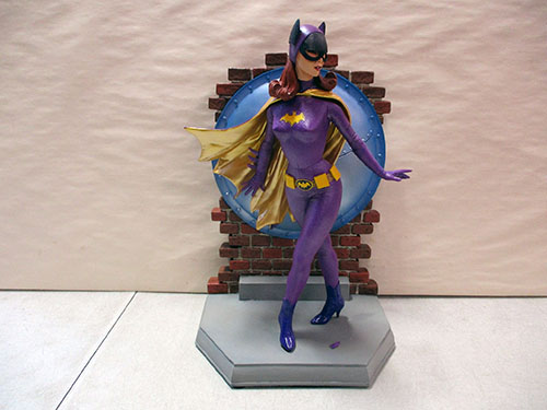 image of Batgirl Figurine with Brick Wall Backdrop