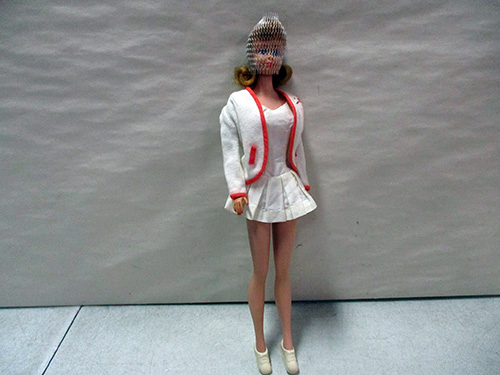 image of Barbie Doll with White Outfit and Orange Accents