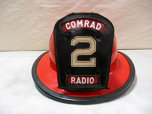 image of Red Firefighter Helmet with Custom Comrad Radio Badge