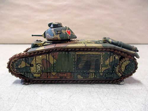 image of Camouflaged Diecast Tank Model with Heart Emblem